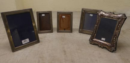 Five silver mounted photograph frames, each on an easel back  mixed marks  largest 8" x 6"