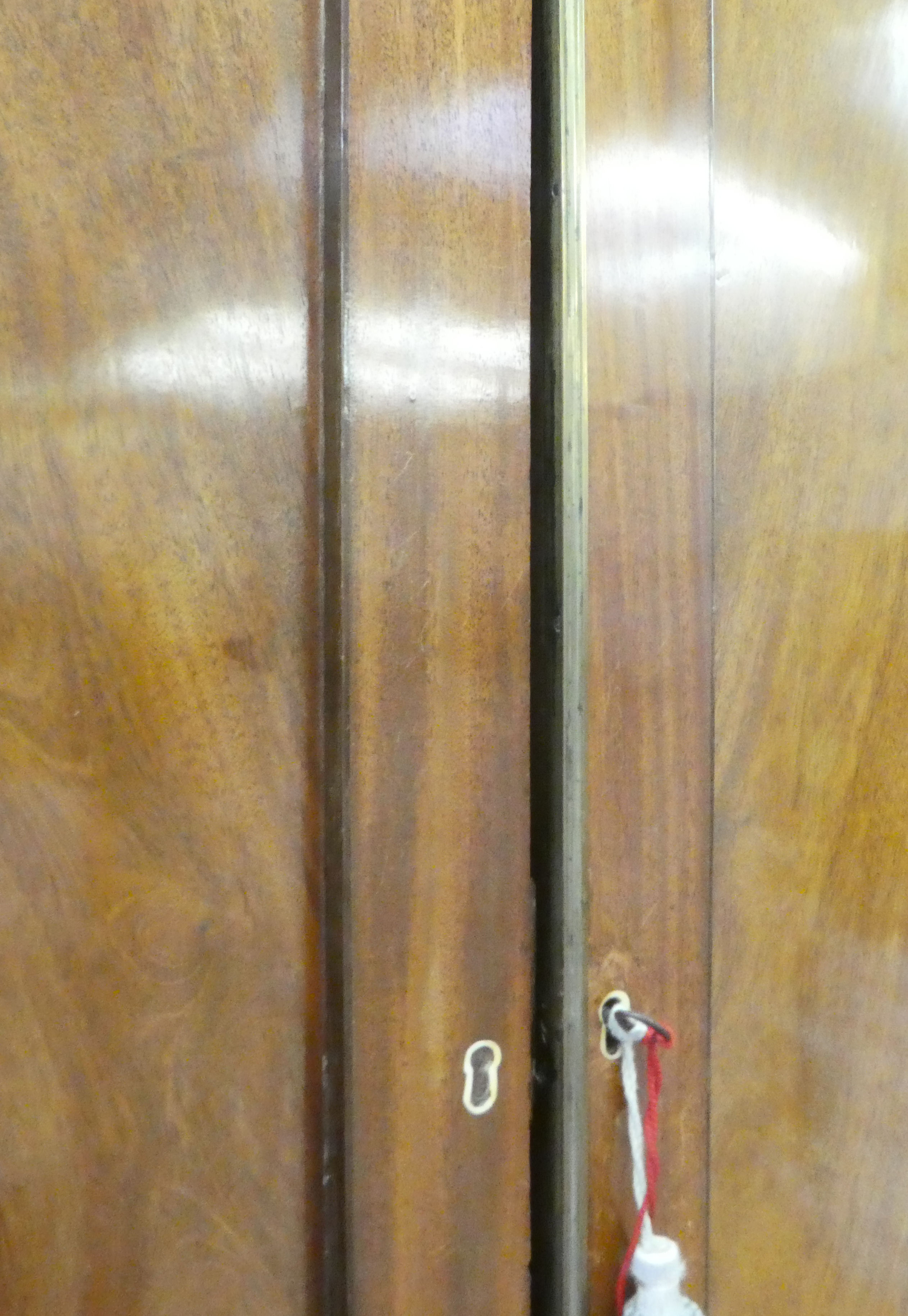 A late Victorian mahogany linen press with a moulded cornice, over a pair of panelled doors, two - Image 5 of 5