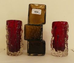 Whitefriars glassware, viz. a brown Drunken Bricklayers vase  8.5"h; and two red knobbly cylindrical