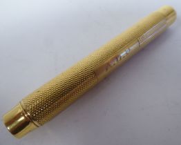 An 18ct gold Sampson Mordan & Co propelling pencil case with a monogram cartouche