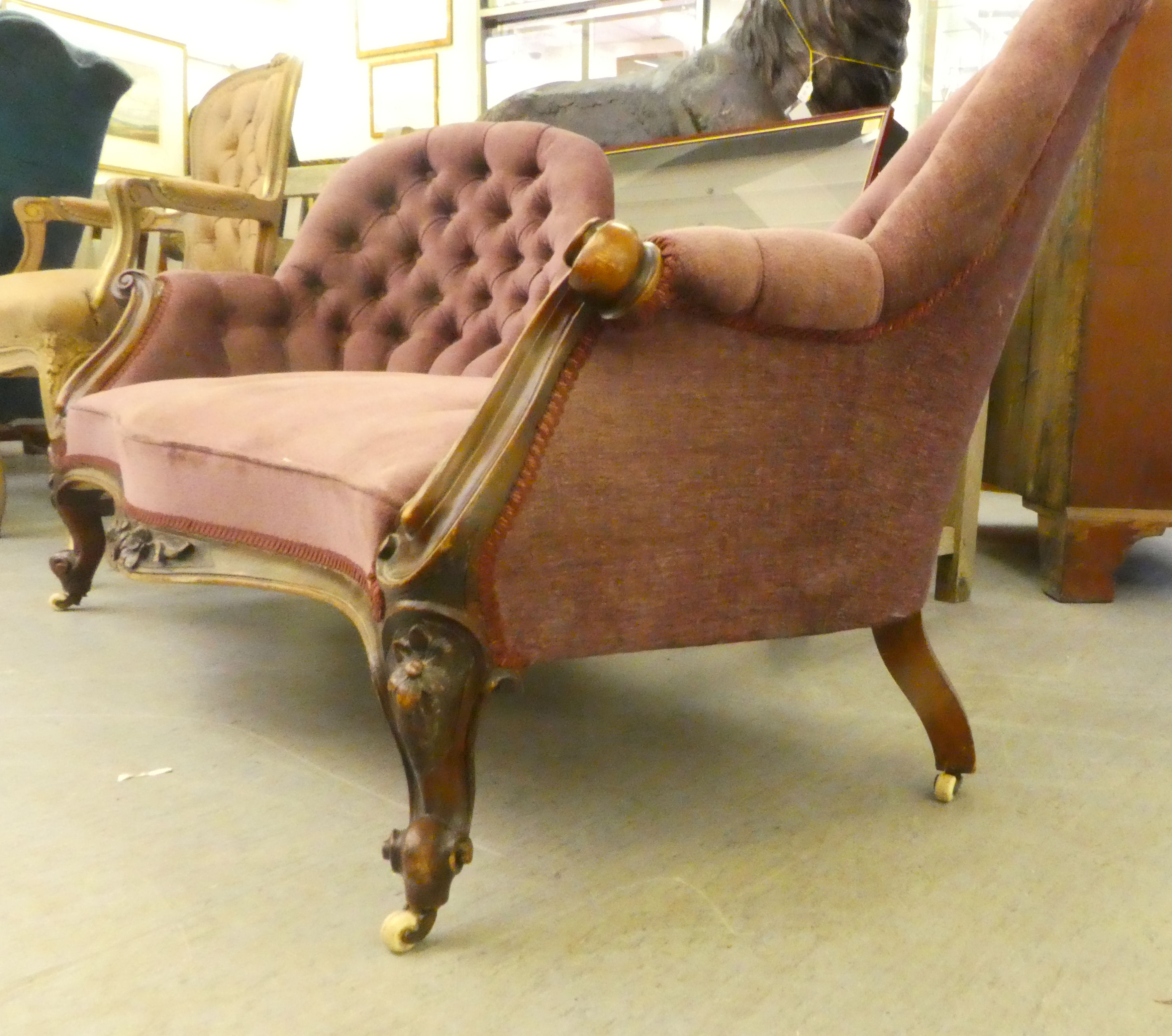 A mid Victorian scroll carved mahogany showwood framed, double spoonback settee, part button - Image 3 of 5