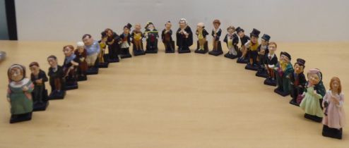 Twenty-four Royal Doulton china figures from 'Oliver' and other Dickens figures  largest 4"h