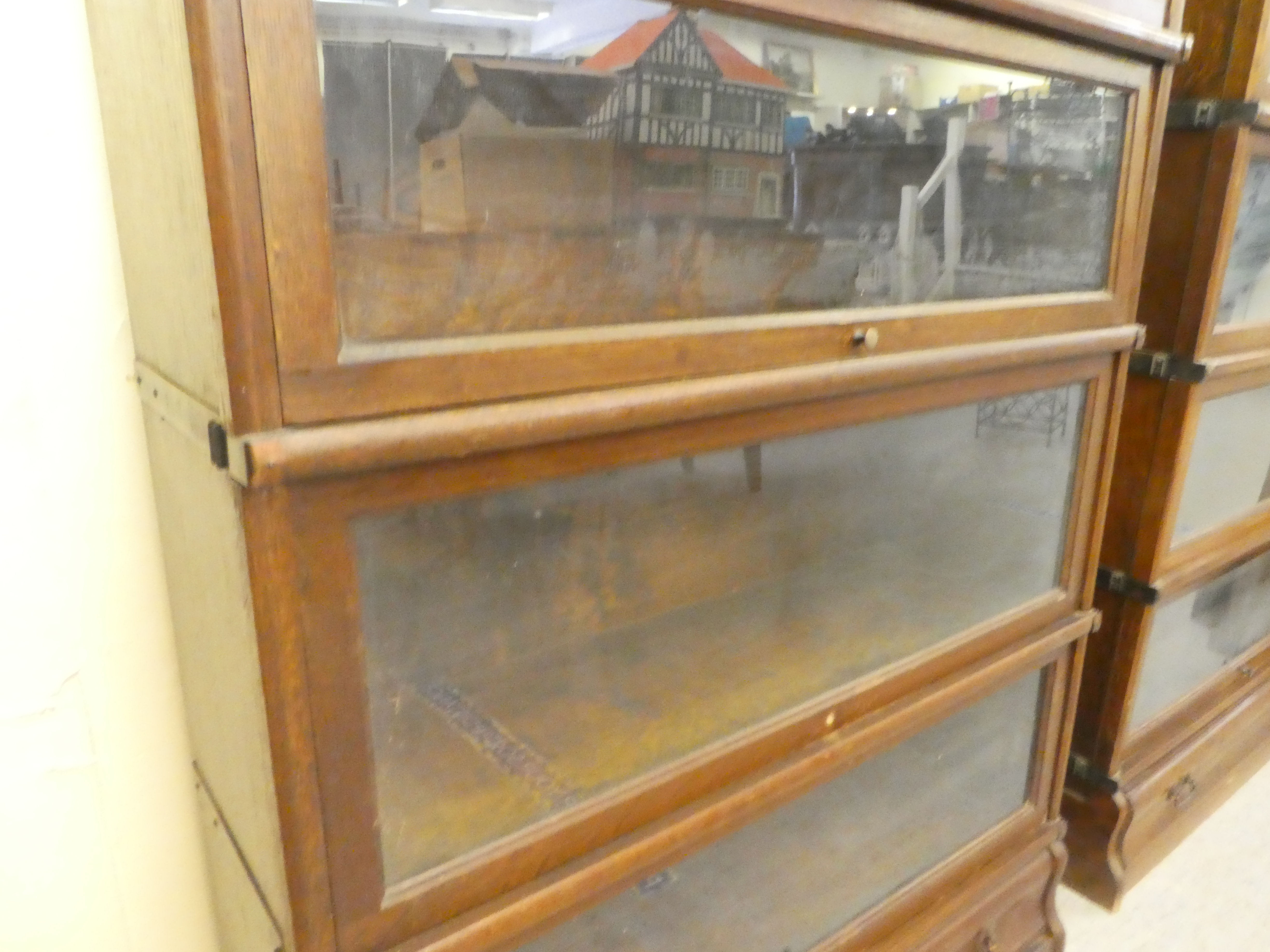 A 1920s/30s oak Globe Wernicke four section bookcase with lift and slide doors and a base drawer, on - Image 4 of 5