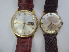 An Excalibur Incabloc gold plated stainless steel wristwatch, faced by an Arabic dial; and a Seiko