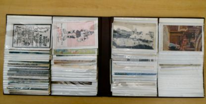 An album containing uncollated variously themed postcards