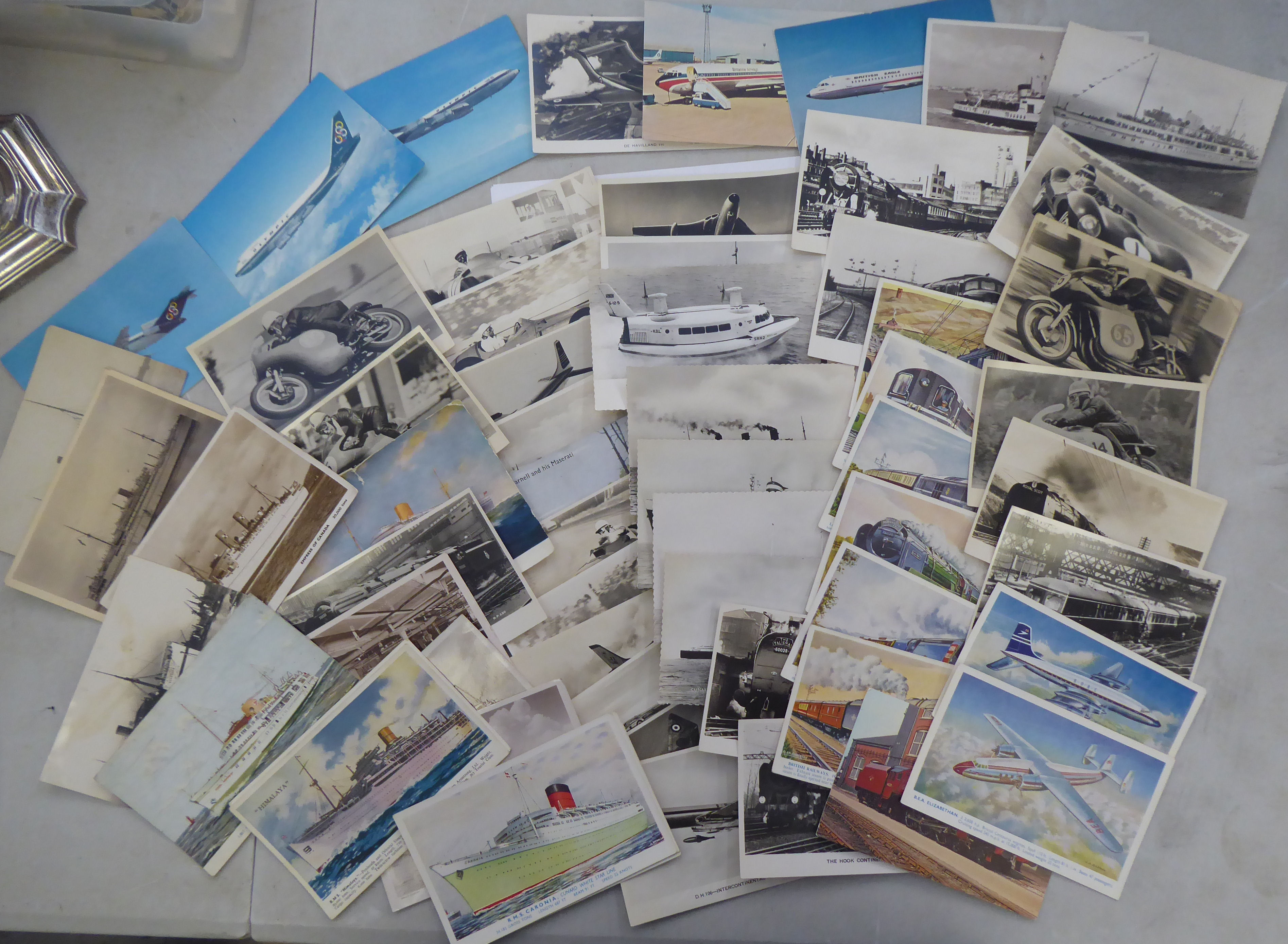 An uncollated collection of postcards, mainly passenger liners, aircraft and motorcycle racing: to