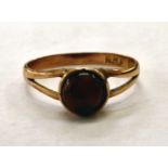 A 9ct gold cabochon cut garnet ring