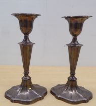 A pair of loaded silver candlesticks, each of oval, knopped form  Sheffield 1901  7"h