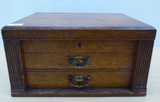 A matched silver plated, variously patterned Harrods and other oak chest canteen of cutlery and