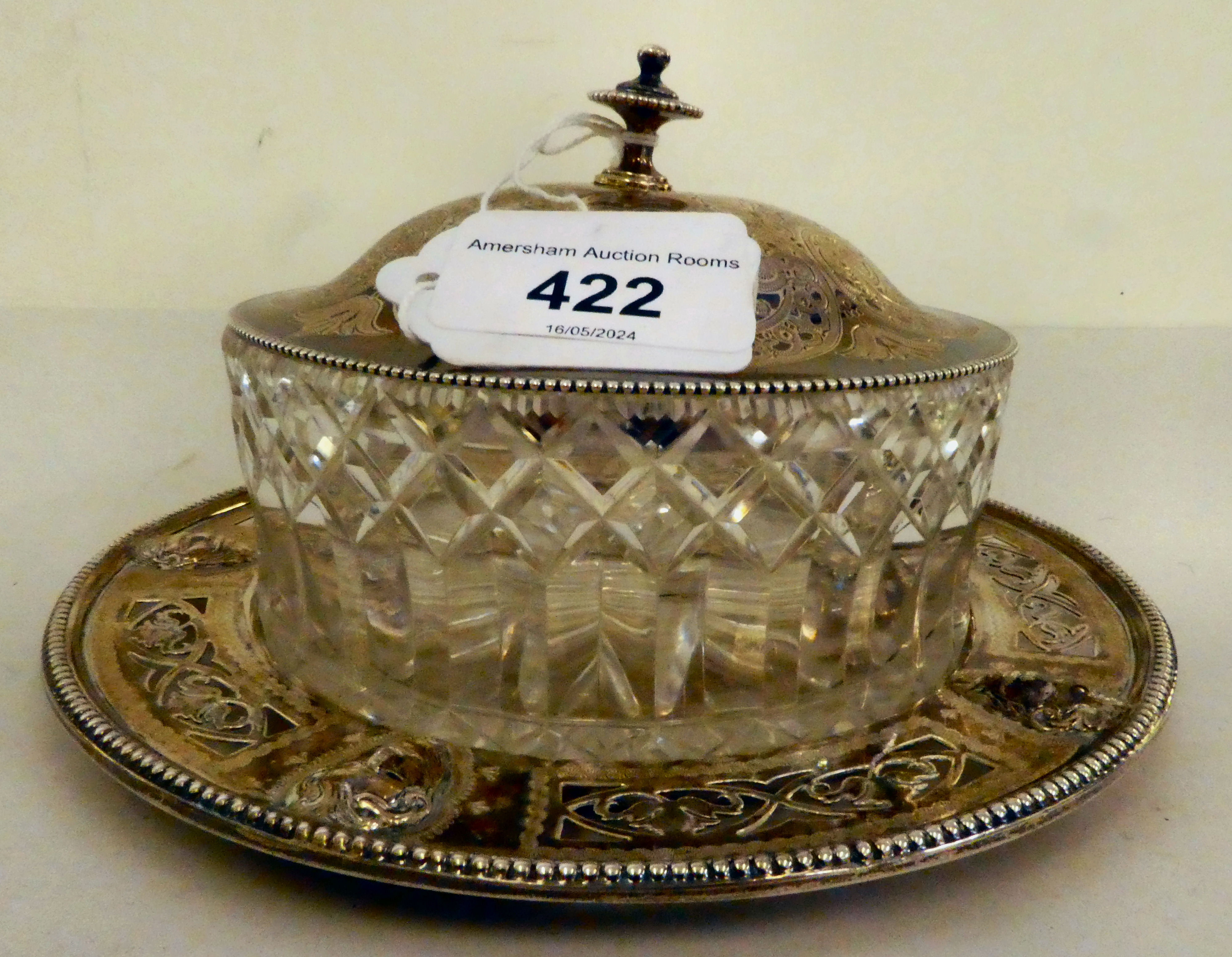 A silver lidded, glazed butter dish, on a silver tray  London 1874