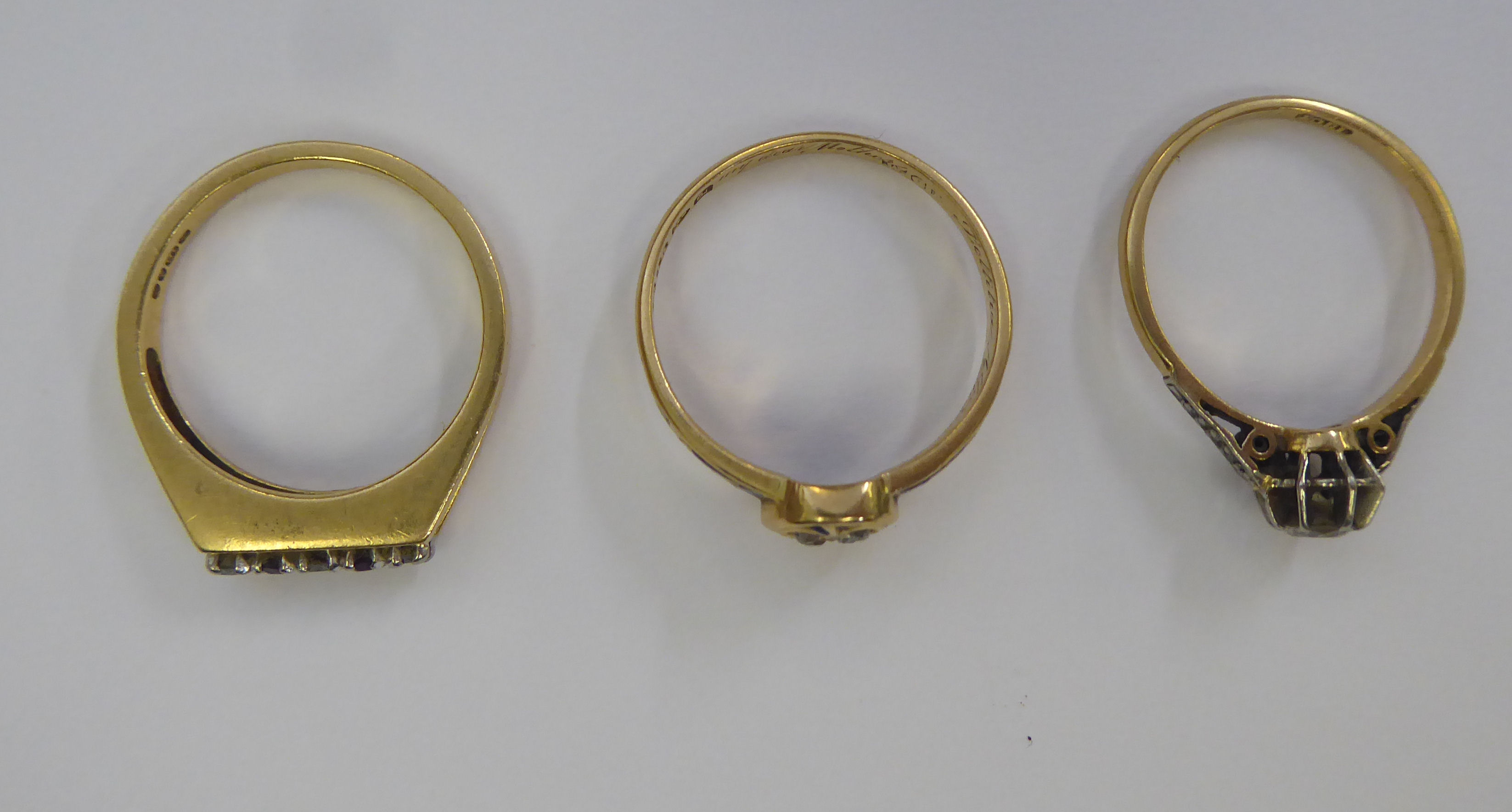 A late Victorian 18ct gold and blue enamel mourning ring; an 18ct gold claw set diamond ring; and - Image 2 of 3