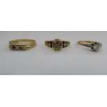 A late Victorian 18ct gold and blue enamel mourning ring; an 18ct gold claw set diamond ring; and