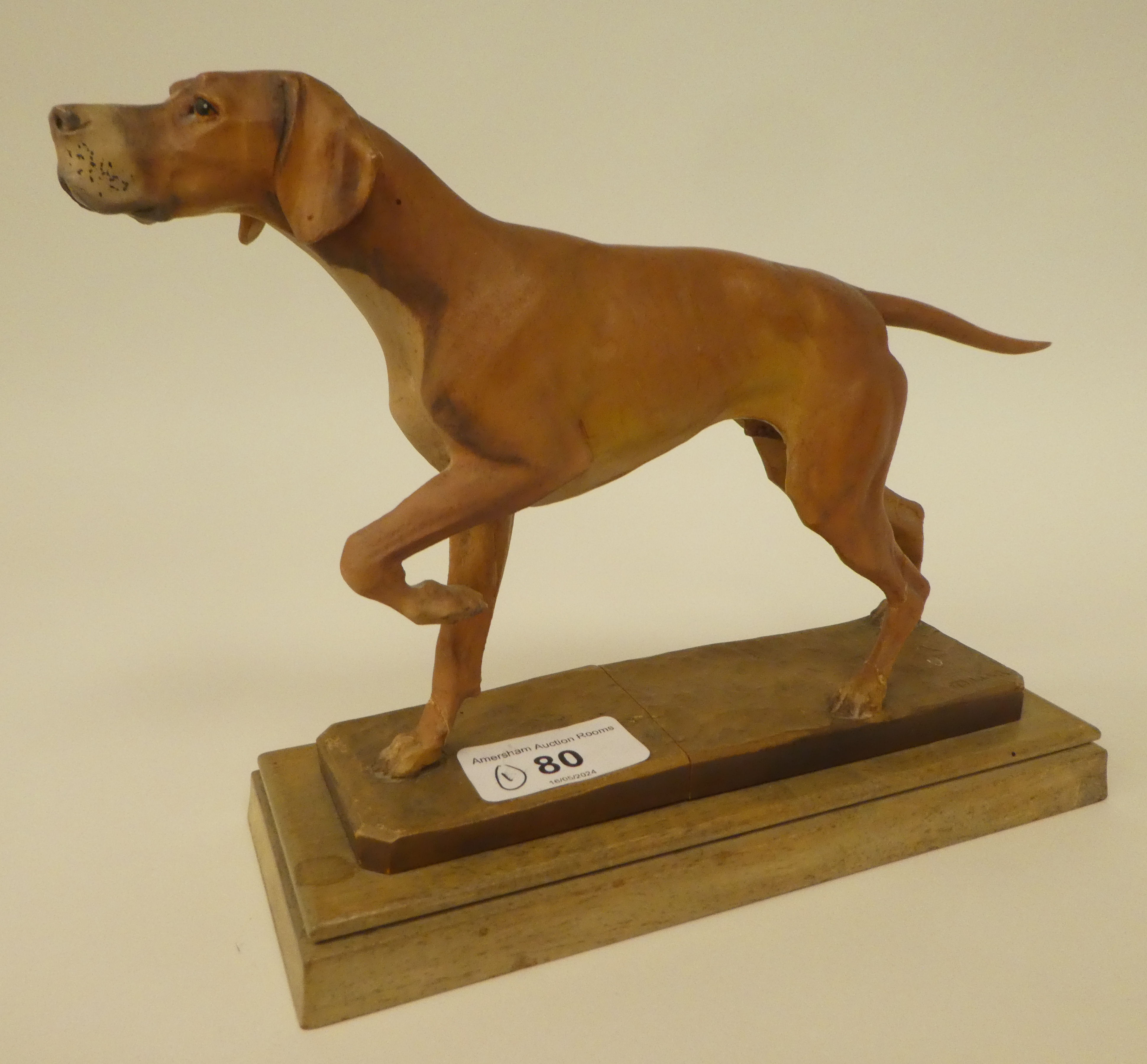 A carved softwood sculpture, a gun dog, on a plinth  bears the signature Diller  6"h overall