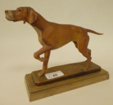 A carved softwood sculpture, a gun dog, on a plinth  bears the signature Diller  6"h overall