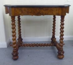 A late 19thC Continental figured walnut and floral marquetry games table with a serpentine