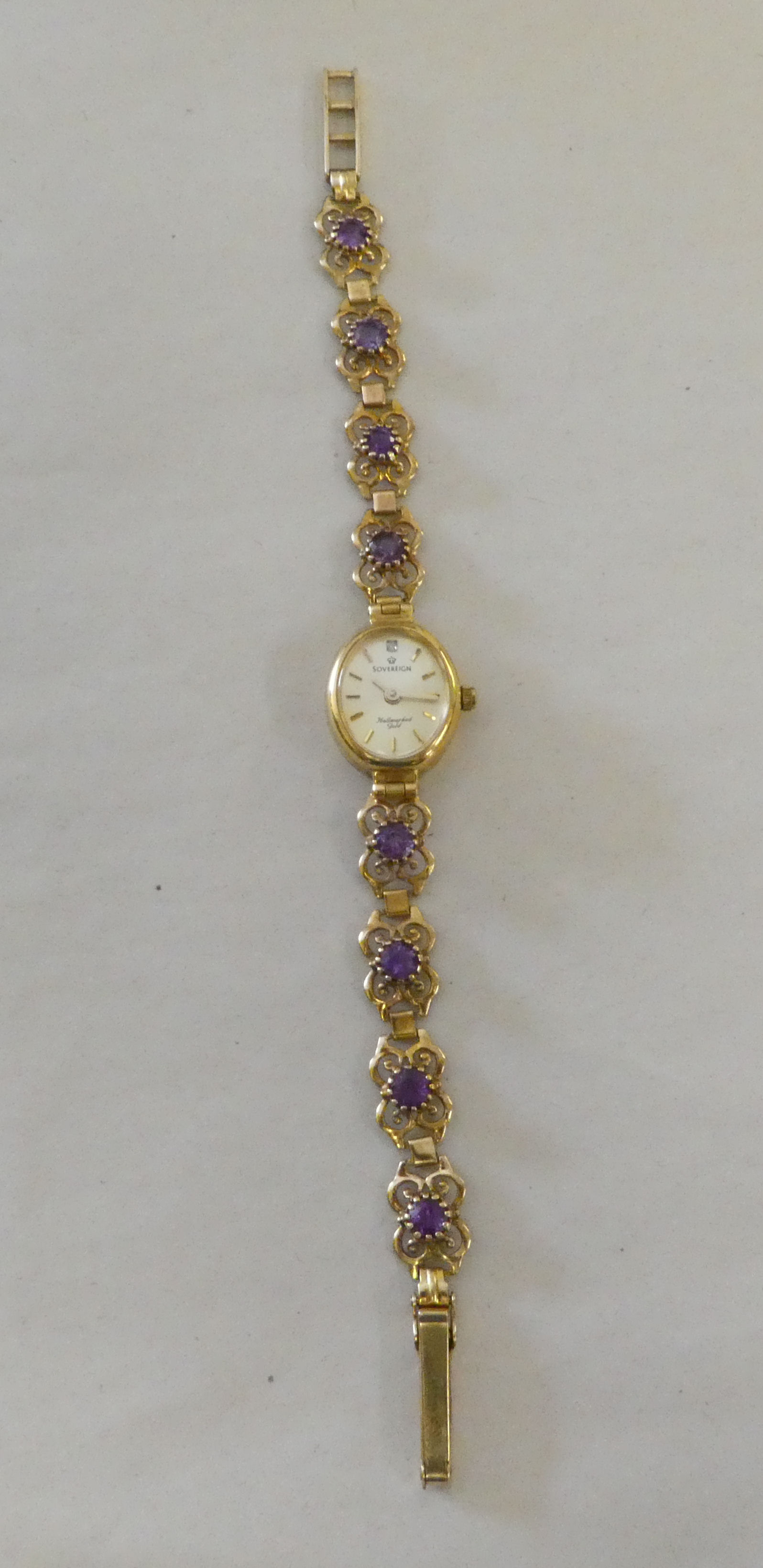 A lady's Hallmark 9ct gold cased bracelet wristwatch, claw set with purple stones, faced by a - Image 3 of 7