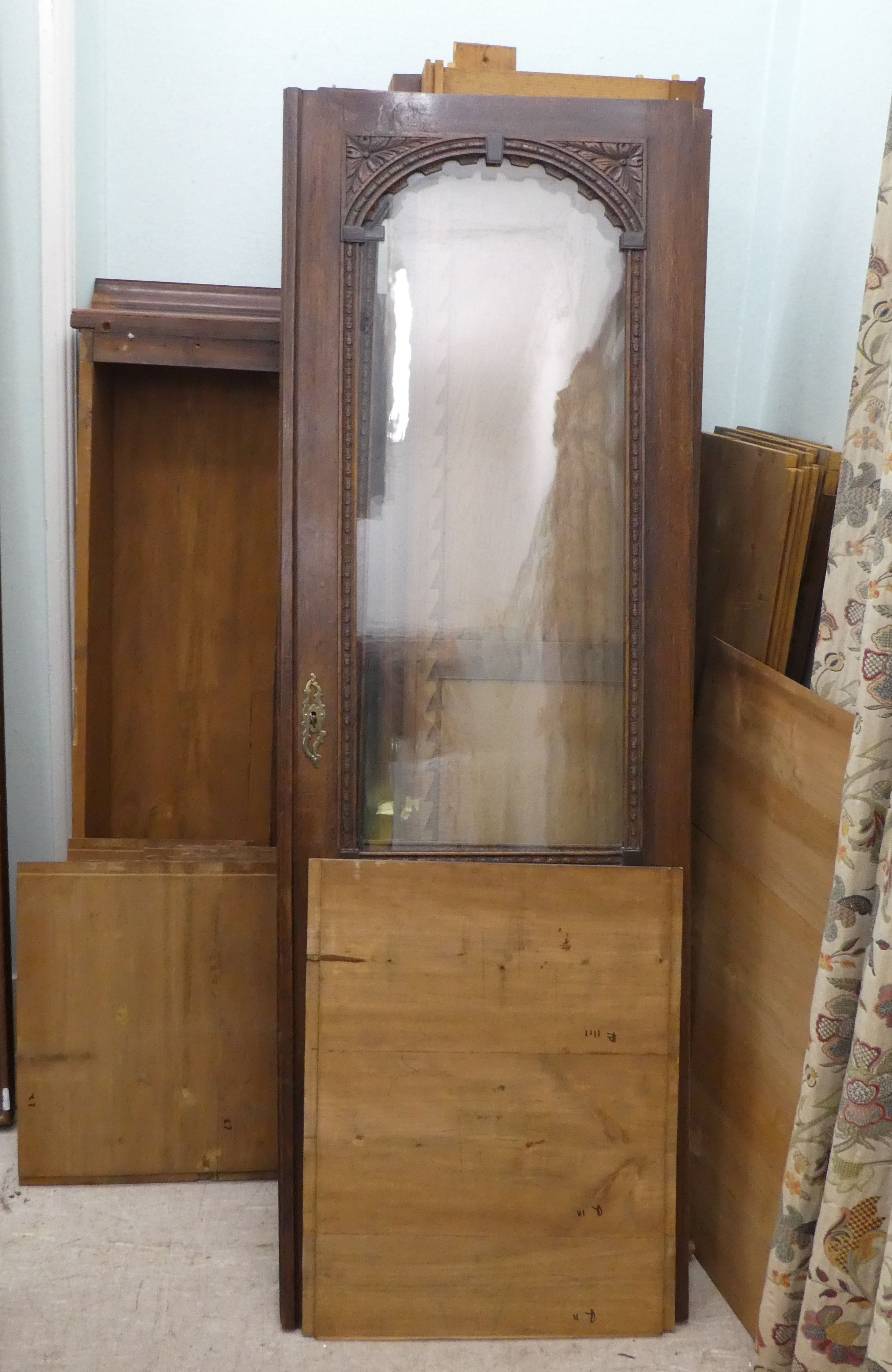 A late Victorian carved and glazed panelled oak twin door bookcase, on a plinth  84"h  56"w