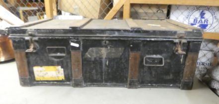 A mid 20thC cast metal trunk  13"h  37"w containing contemporary wooden and metal implements and