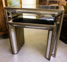 A modern nesting pair of mirror panelled and silvered metal occasional tables  largest 24"h  27"w