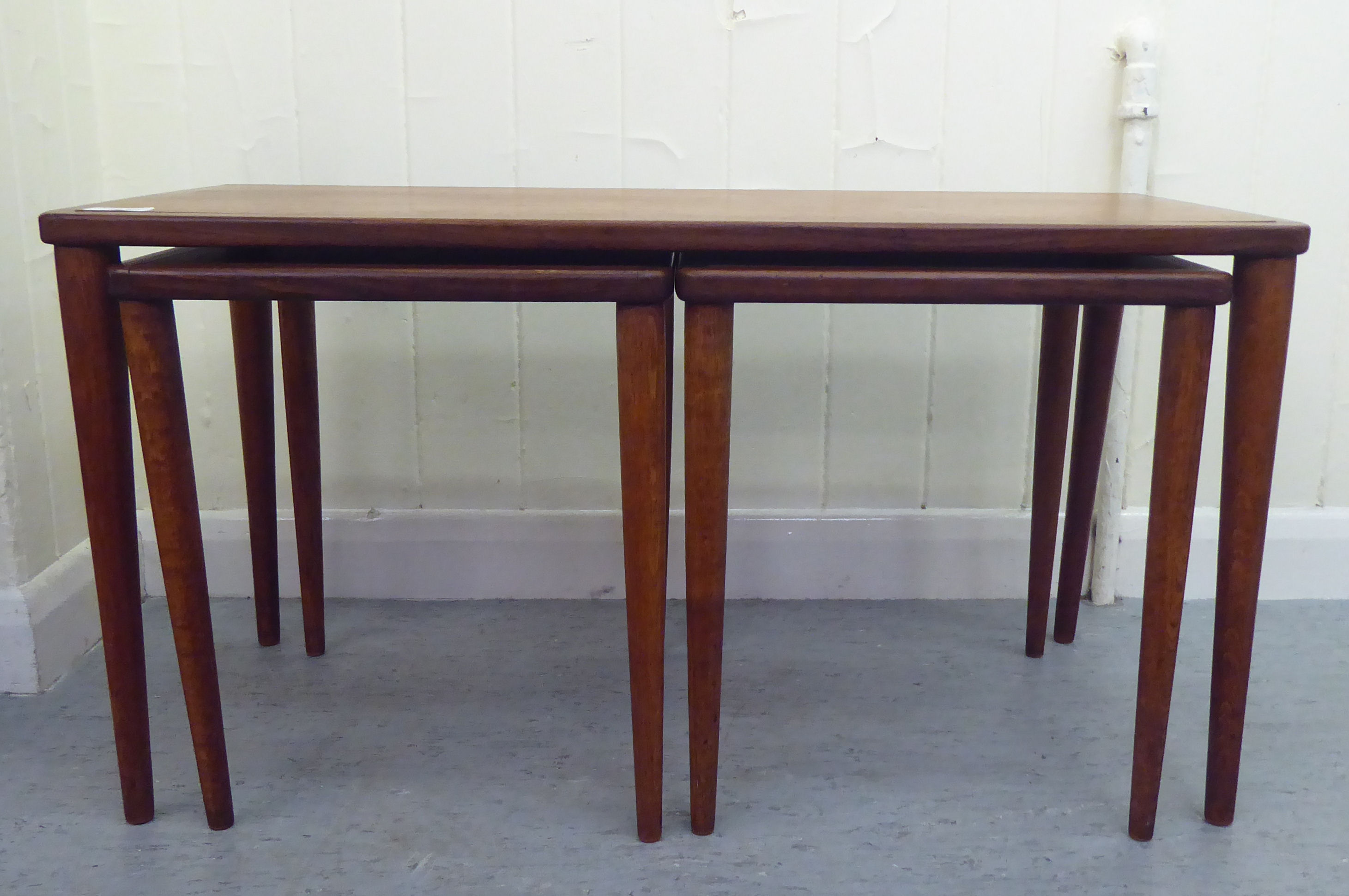 In the manner of Yngue Ekstron for Kallemo nesting set of three Cubus teak tables  largest 16"h