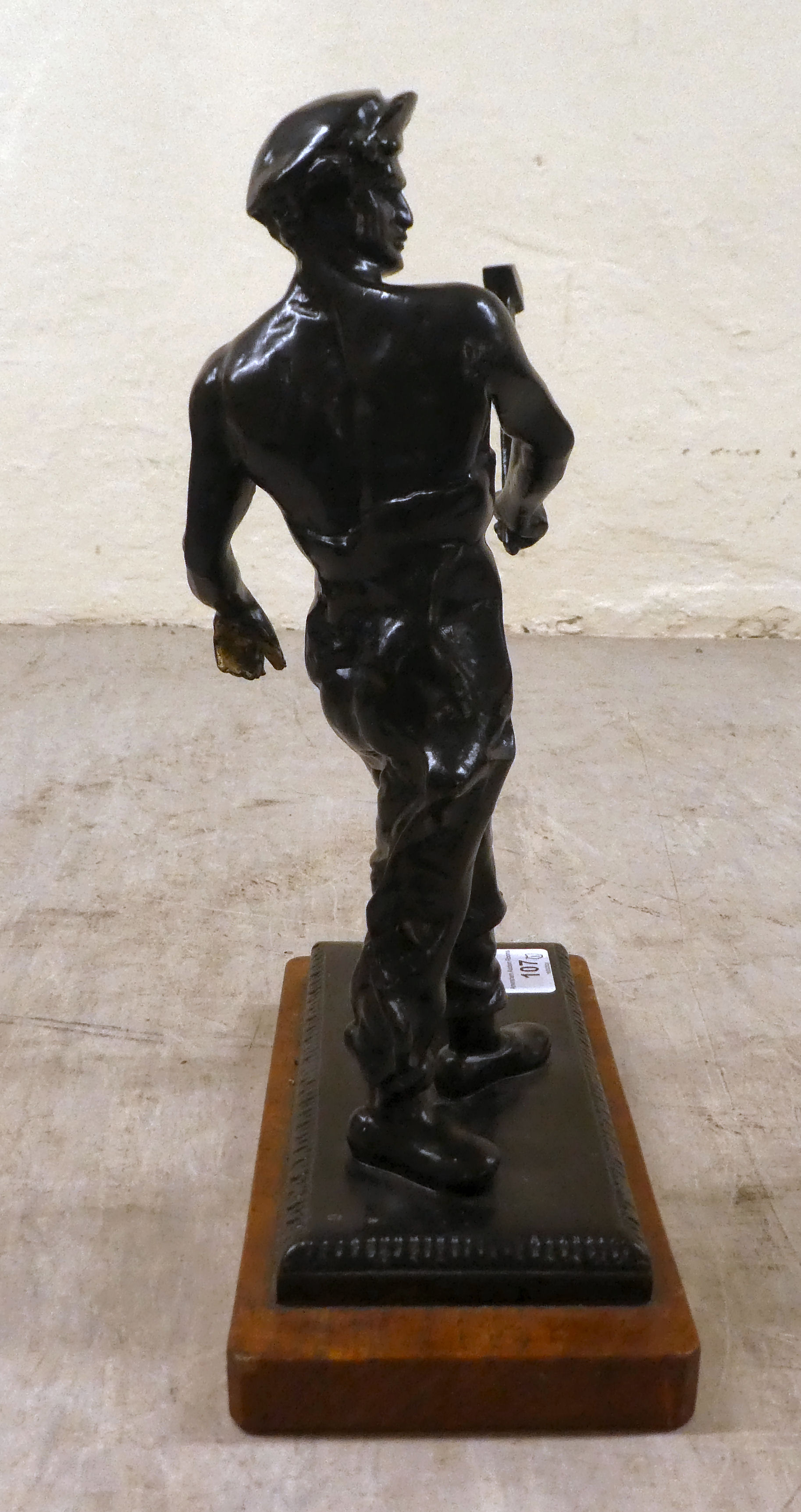 A patinated bronze model  'Ironmonger' on a wooden plinth  14"h - Image 2 of 5