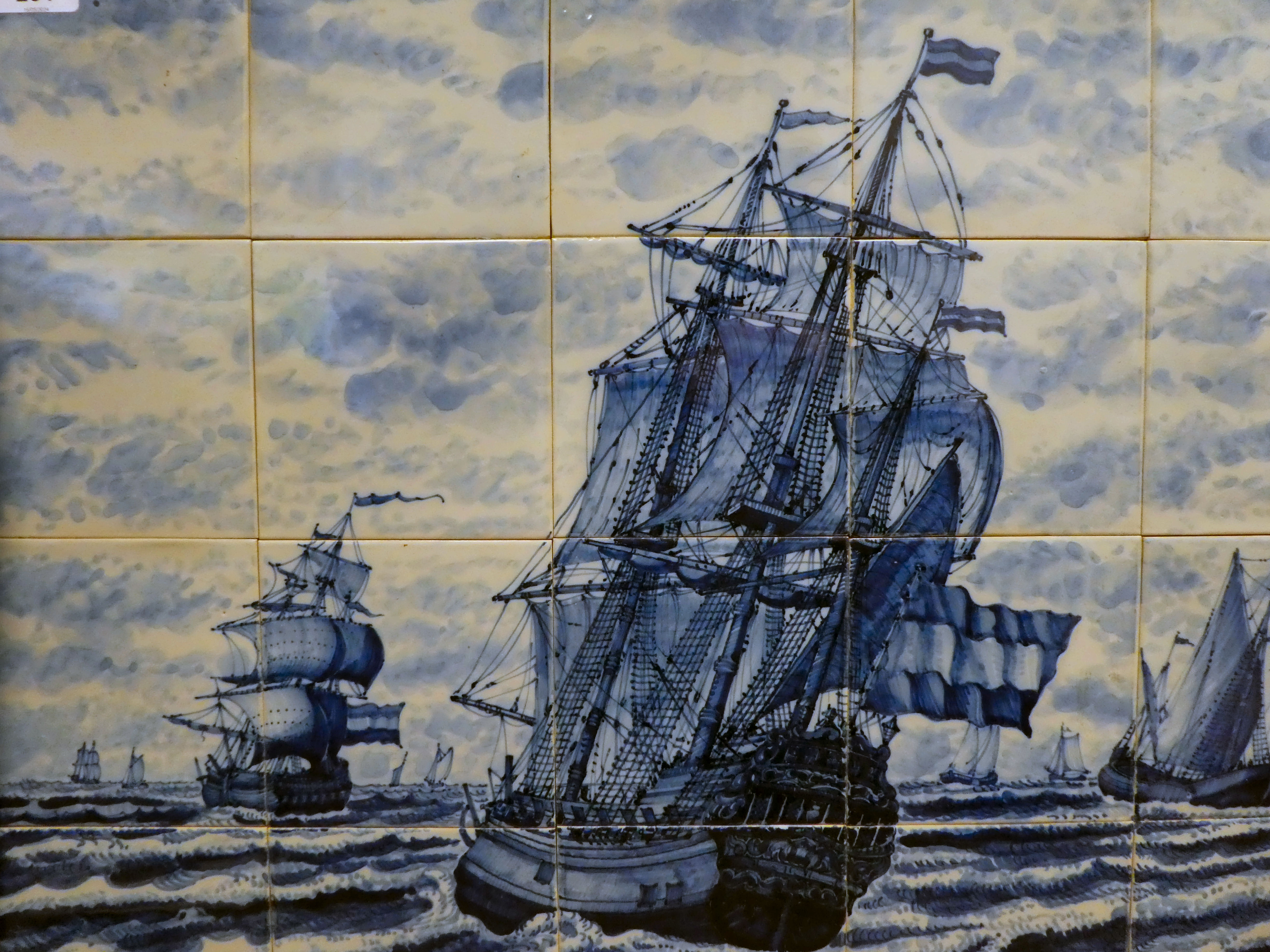 A framed group of twenty modern Delft inspired blue and white pottery tiles, depicting galleons at - Image 2 of 3