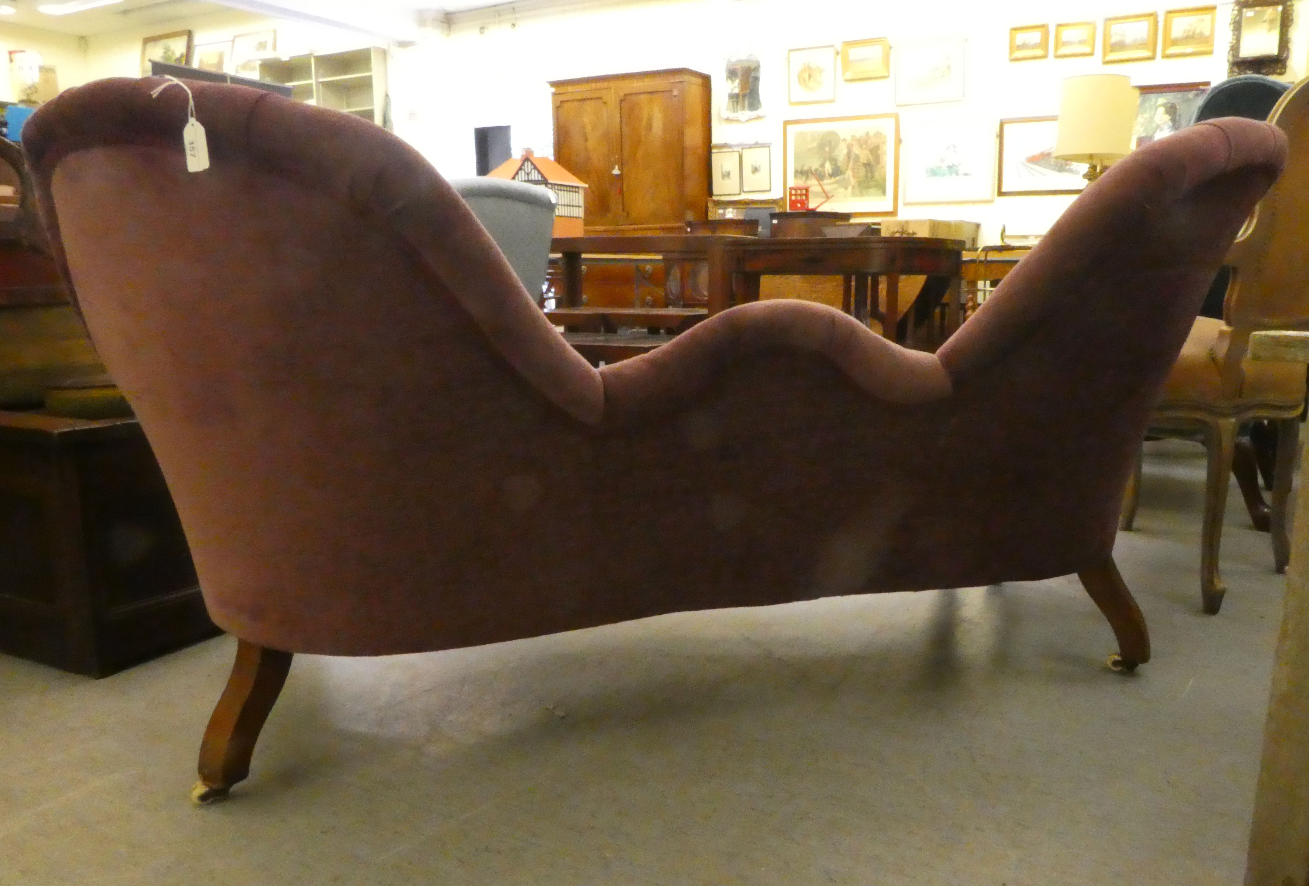 A mid Victorian scroll carved mahogany showwood framed, double spoonback settee, part button - Image 4 of 5