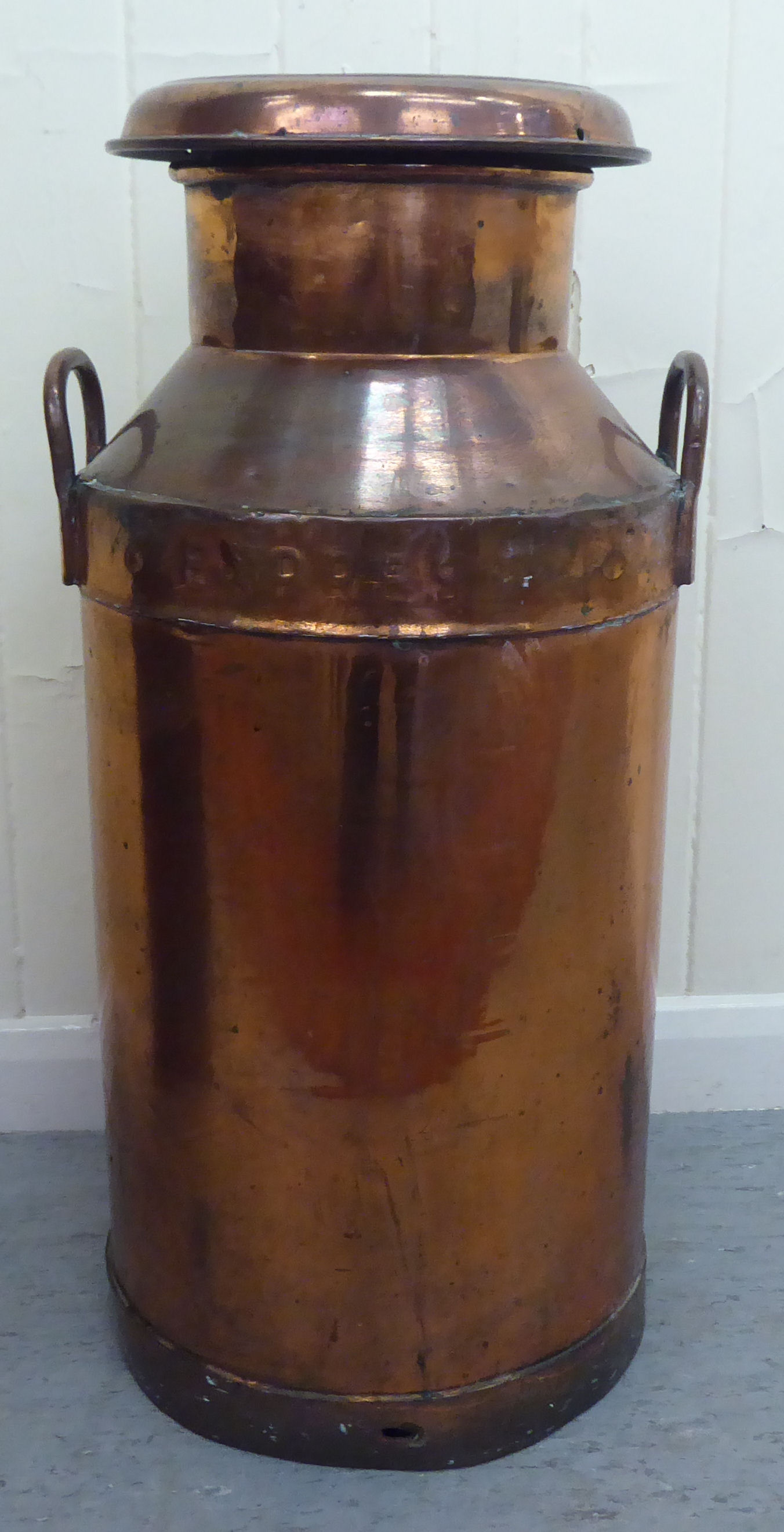 An early/mid 20thC copper Express Dairy Co twin handled milk churn  29"h