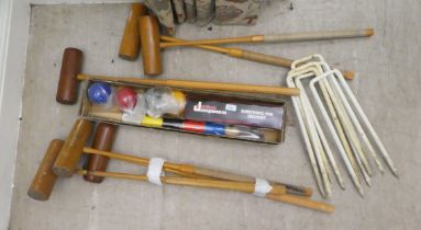Six croquet mallets; four balls and pegs