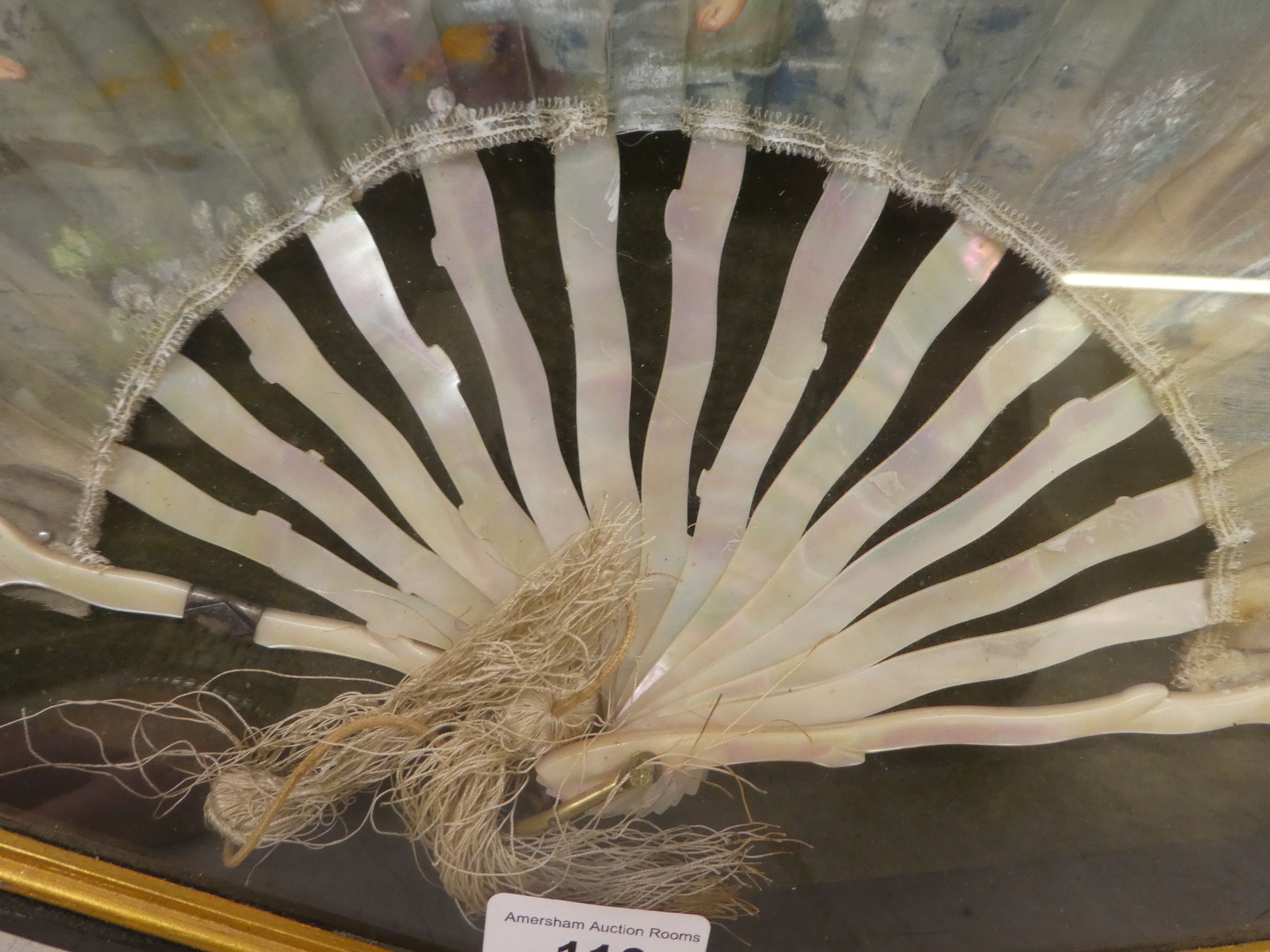 An early 20thC fan, decorated with dancing female figures, on mother-of-pearl spines, in a glazed - Image 2 of 6
