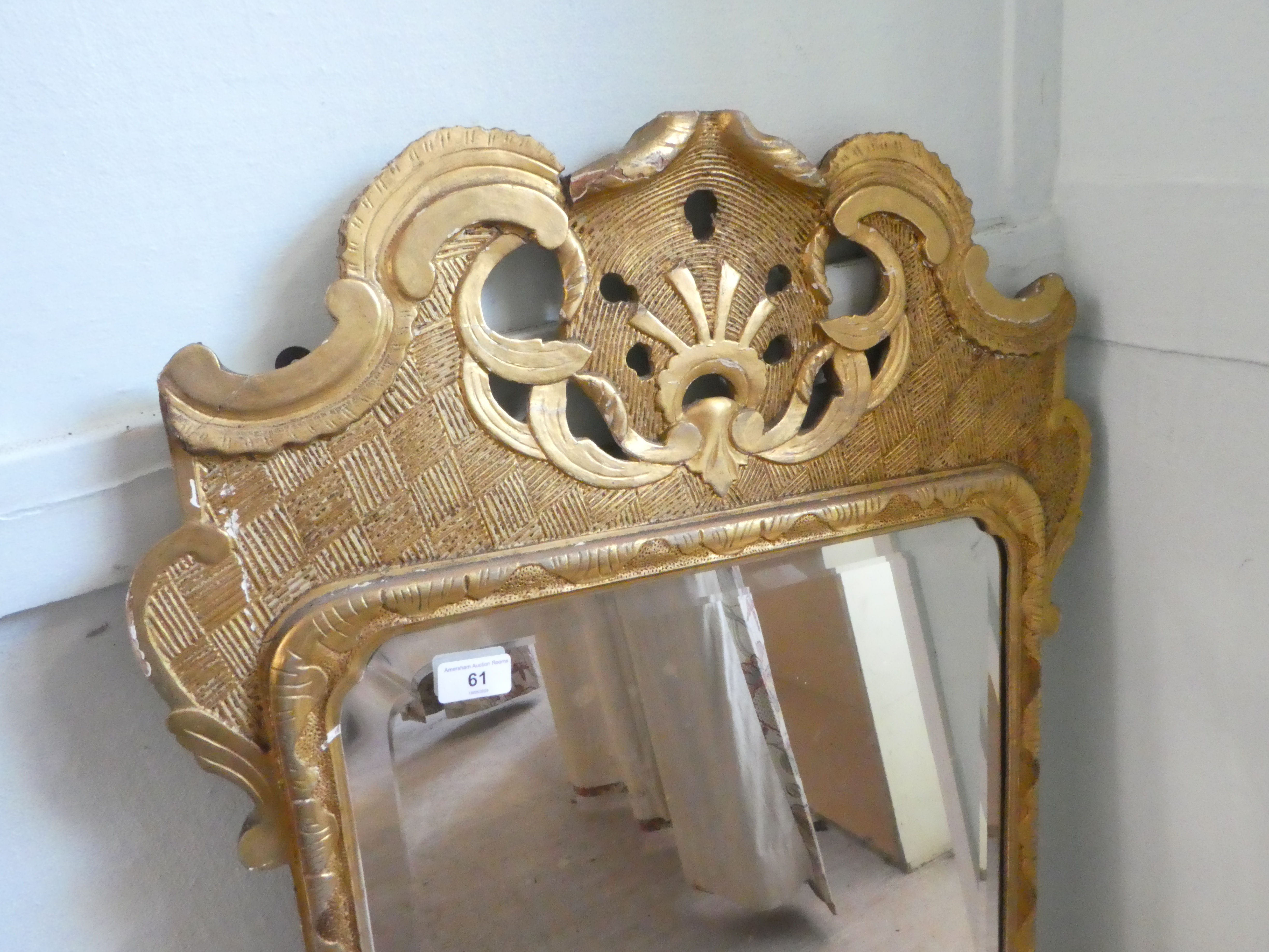 An early 20thC mirror, the shaped, bevelled plate set in a gilded pine frame  44" x 24" - Image 3 of 5