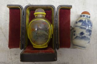 A Chinese painted glass snuff bottle  2.75"h; and another porcelain example  2.75"h