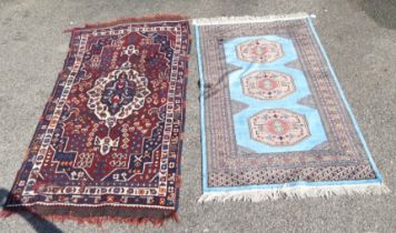 Two rugs, each on multi-coloured grounds  37" x 59" and 35" x 62"