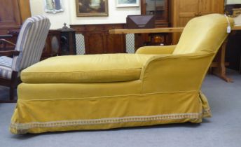 A 1930s mustard coloured fabric upholstered day bed