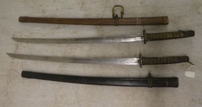 Two similar reproductions of World War II Japanese kutanas, the blades 25"L in lacquered scabbards