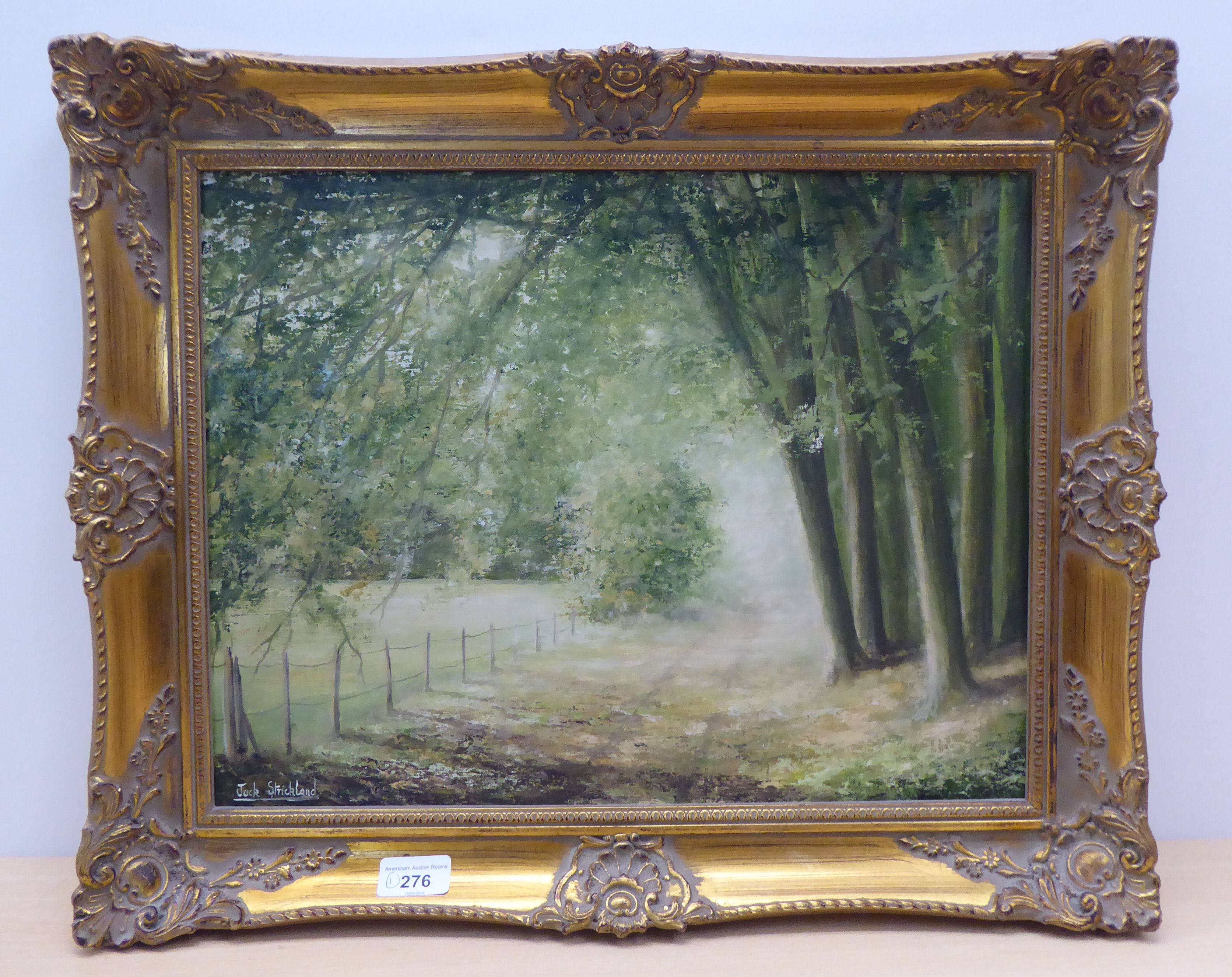 Jack Strickland - a woodland path  oil on board  bears a signature  13" x 17"  framed