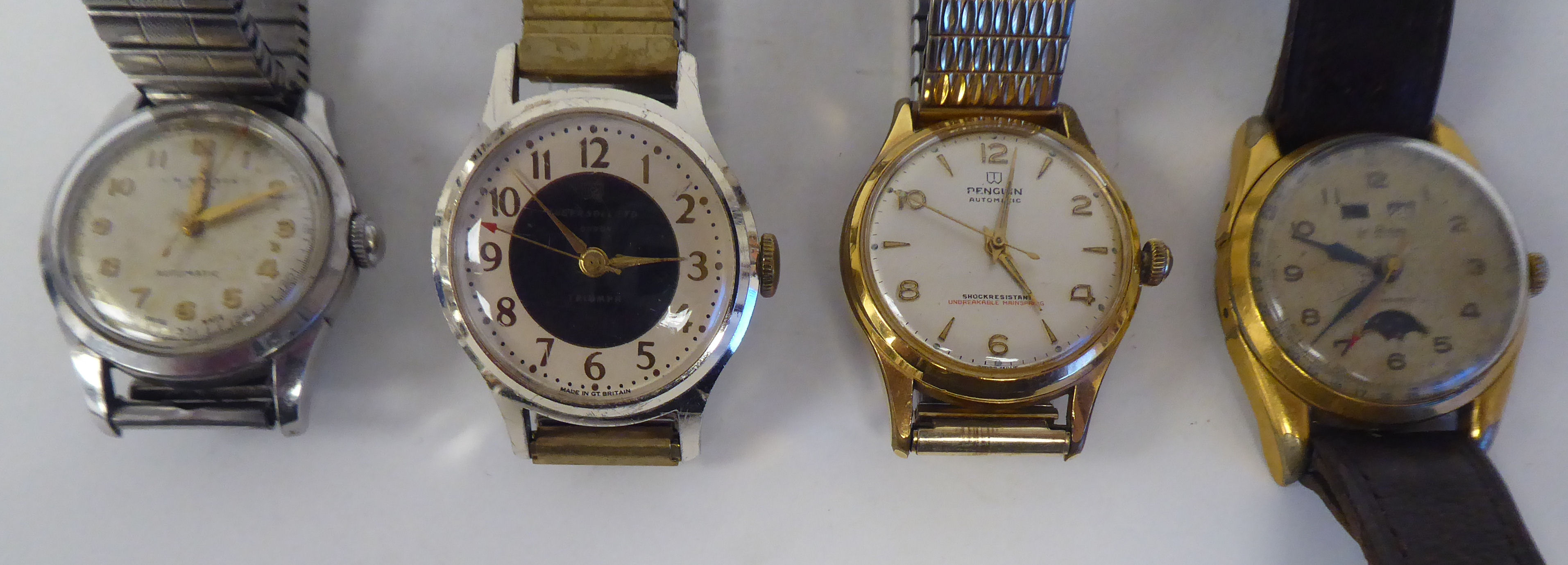 Four variously cased and strapped vintage wristwatches