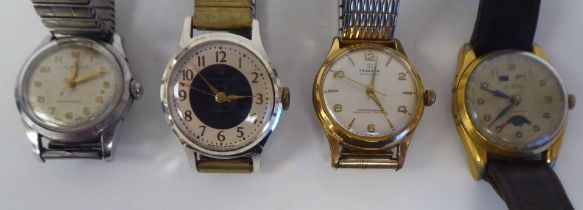 Four variously cased and strapped vintage wristwatches