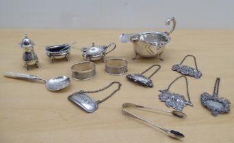 Silver and silver plated collectables: to include a sauce boat; decanter labels and flatware