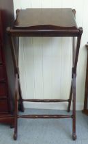 A modern mahogany lectern, on a stained beech crossover frame  38"h  19"w