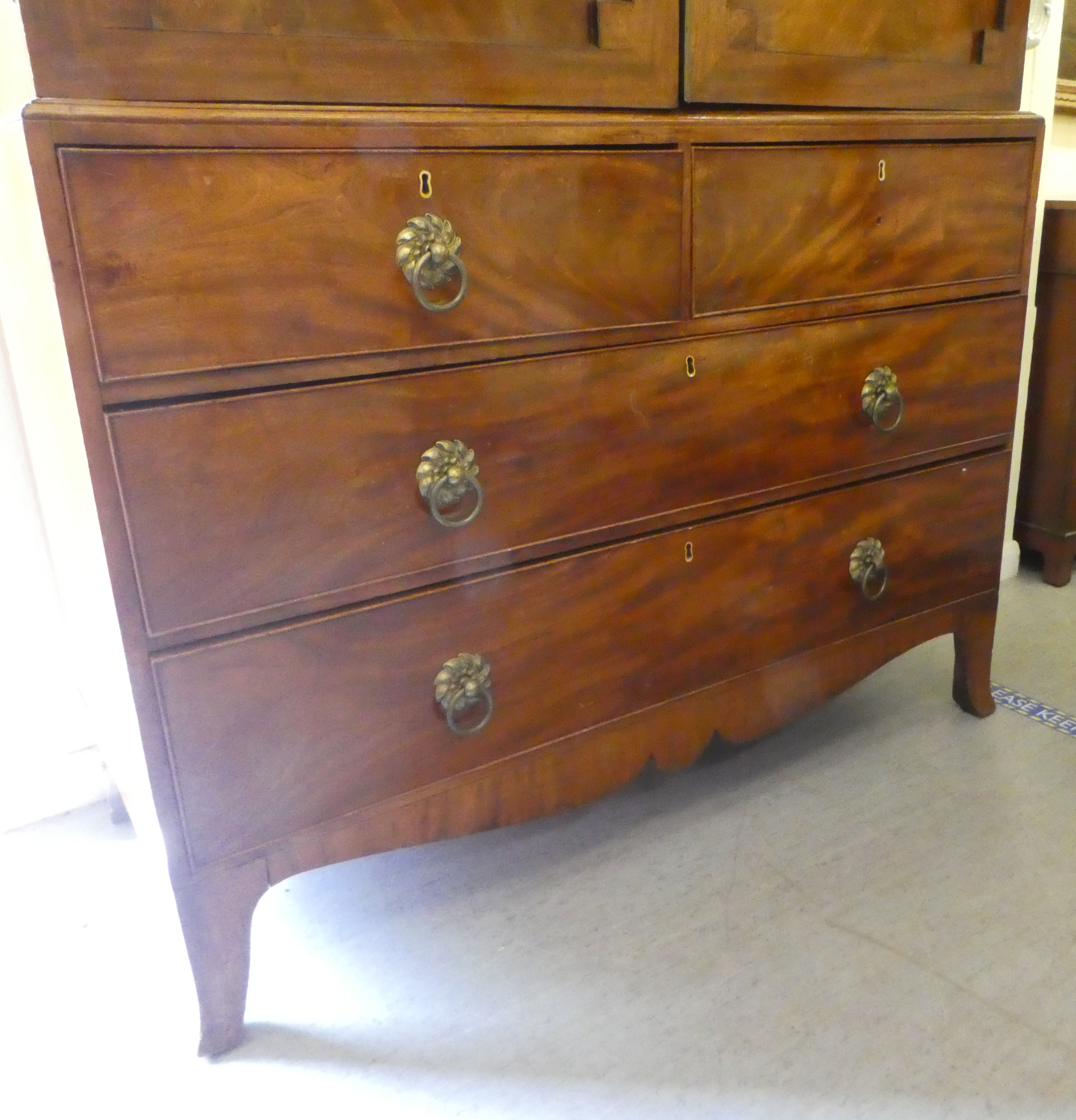 A late Victorian mahogany linen press with a moulded cornice, over a pair of panelled doors, two - Image 2 of 5