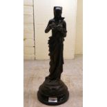 A patinated spelter figure, after Carrier Belleuse, a woman reading a book  17"h