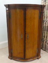 A George III oak quadrant corner cabinet  40"h  27"w