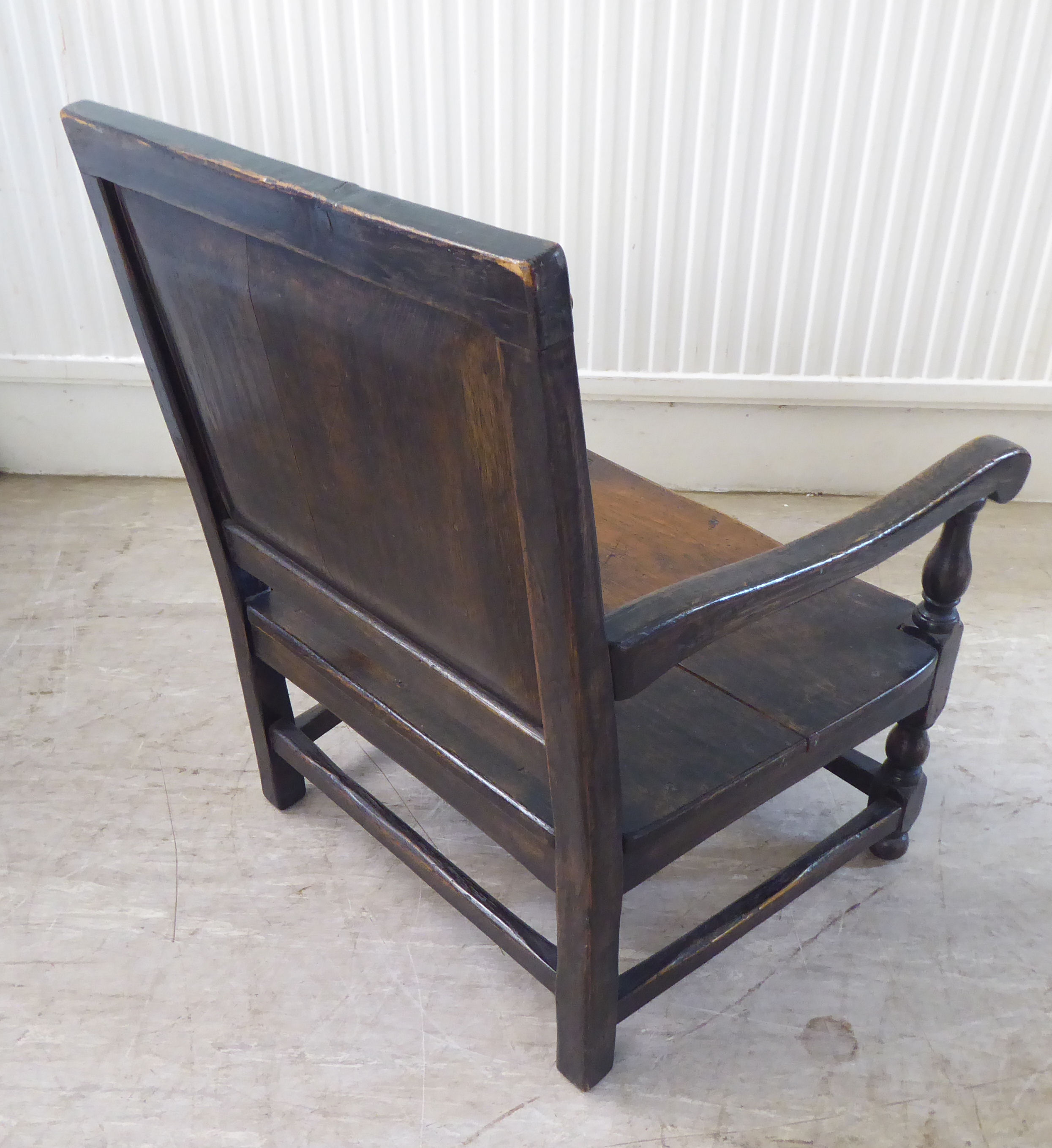 An antique finished, dark stained oak floral marquetry, panelled back, low, open arm chair with a - Image 4 of 5