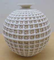 A cream coloured porcelain vase, fashioned as a woven basket of waisted baluster form  11"h