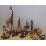 20thC wooden and other carvings: to include figures and model animals  largest 24"h