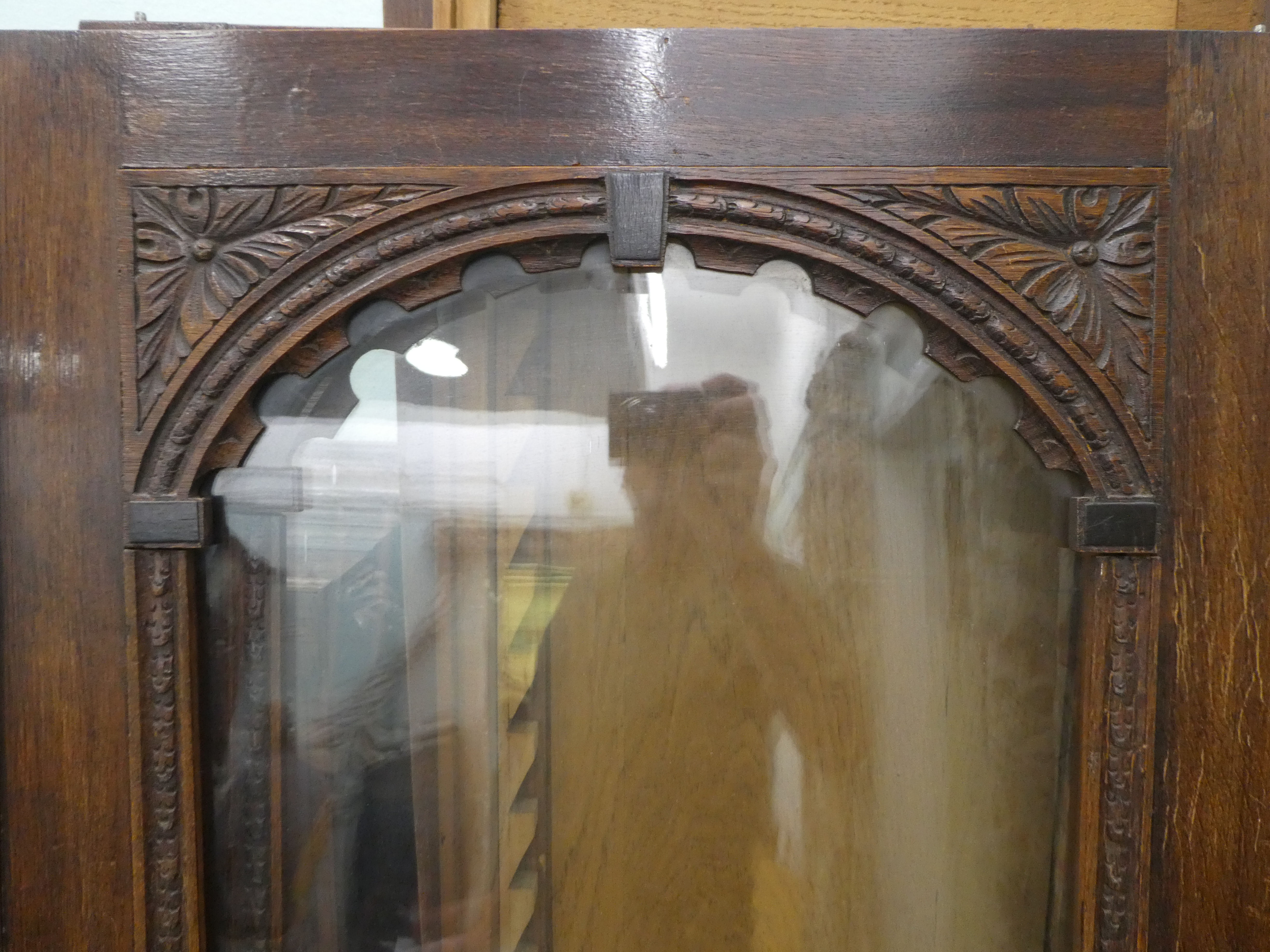 A late Victorian carved and glazed panelled oak twin door bookcase, on a plinth  84"h  56"w - Image 3 of 3