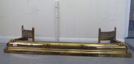 An early/mid 20thC brass fire curb  48"w