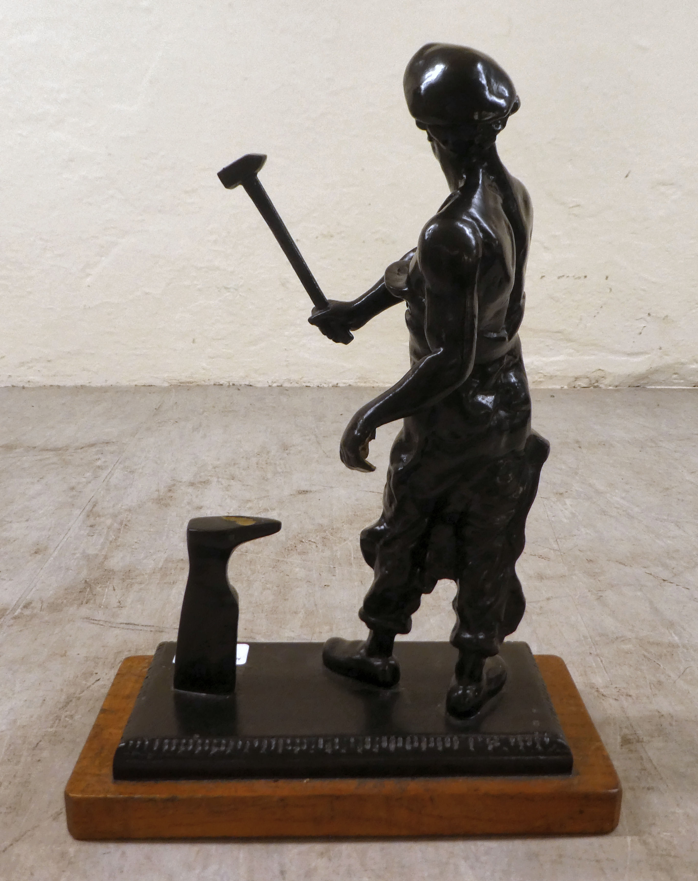 A patinated bronze model  'Ironmonger' on a wooden plinth  14"h - Image 3 of 5