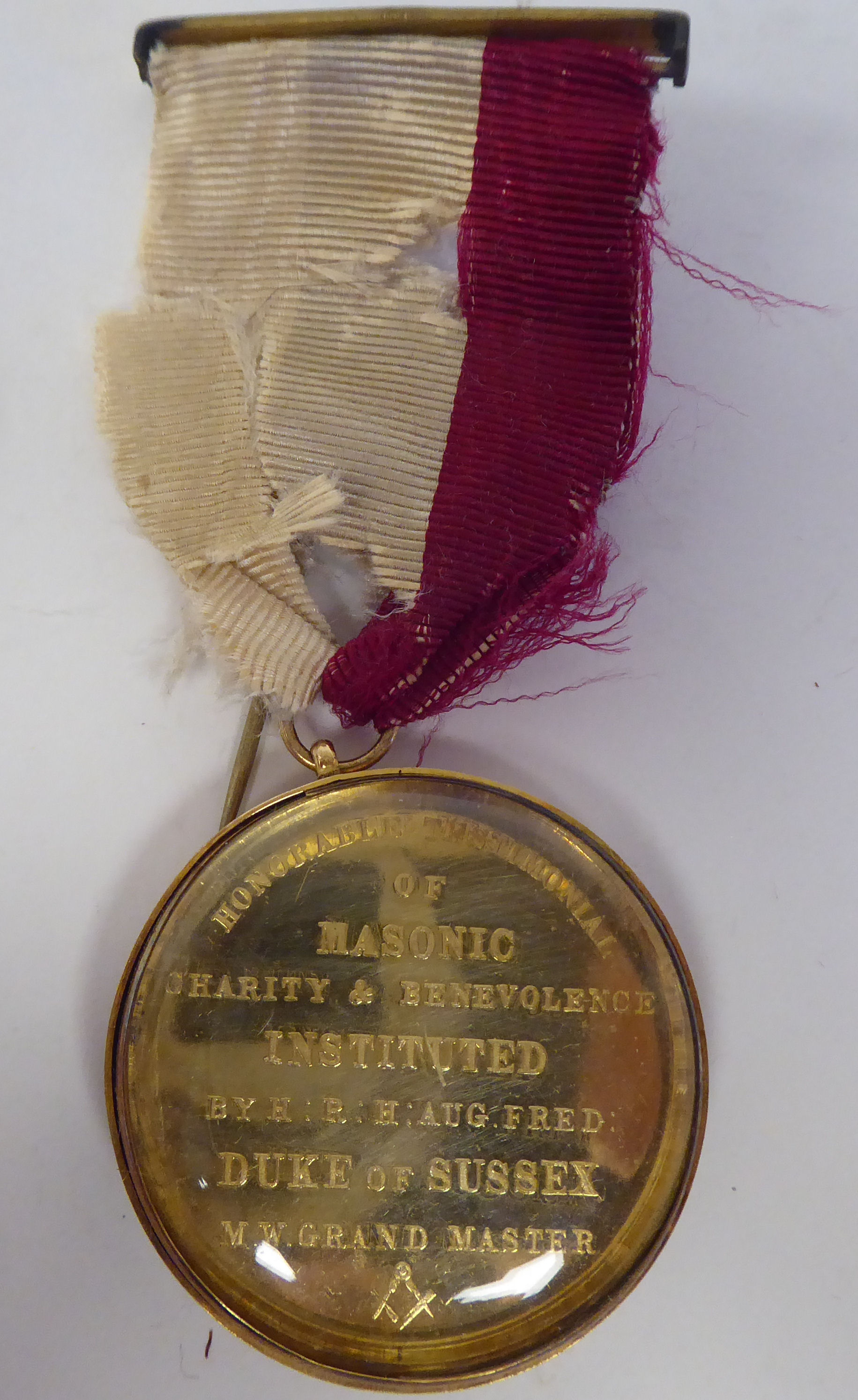 An Honourable Testimonial of Masonic Charity & Benevolence medal, in a 15ct gold mount, inscribed
